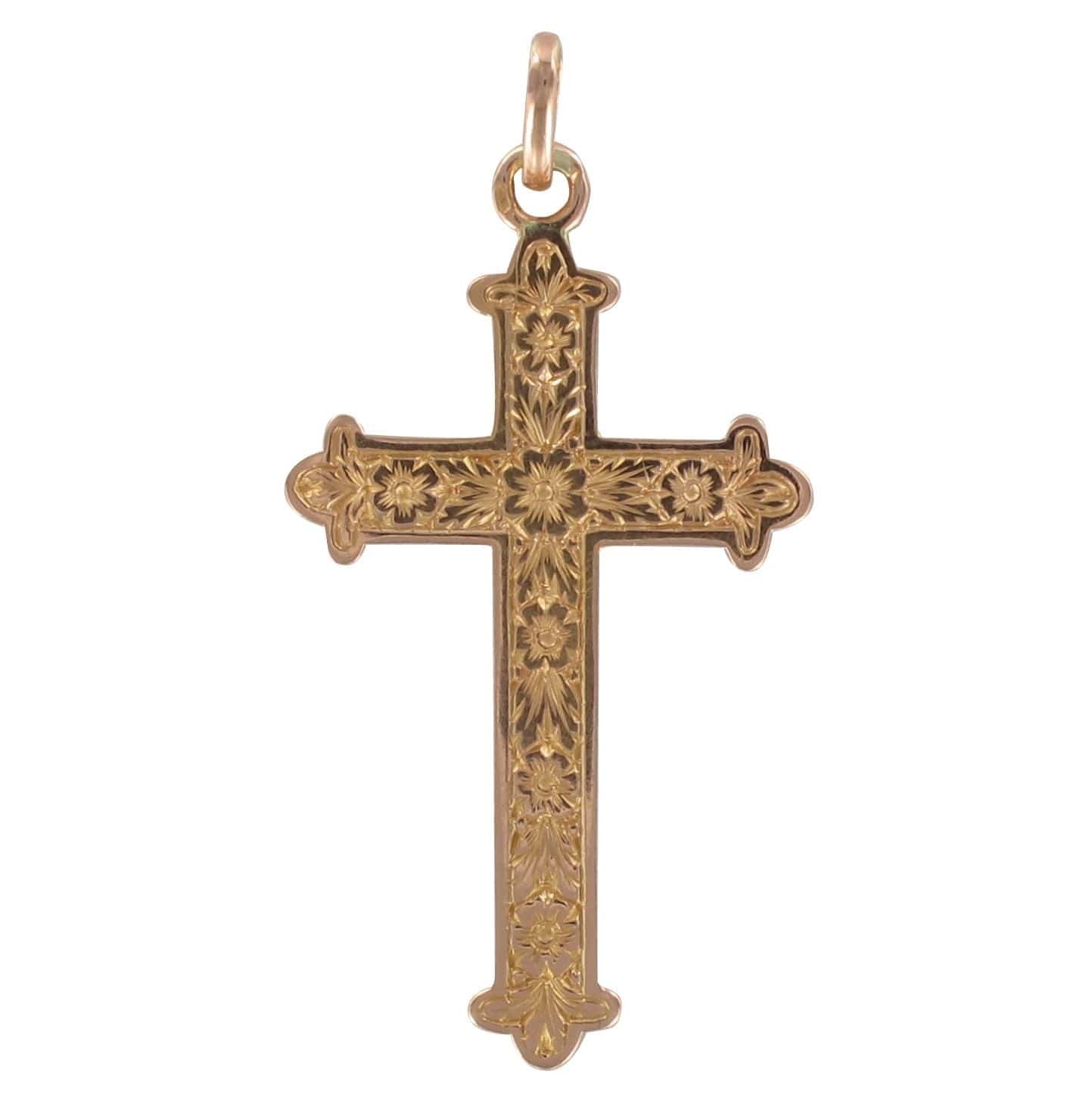 Old rose gold cross with floral carvings