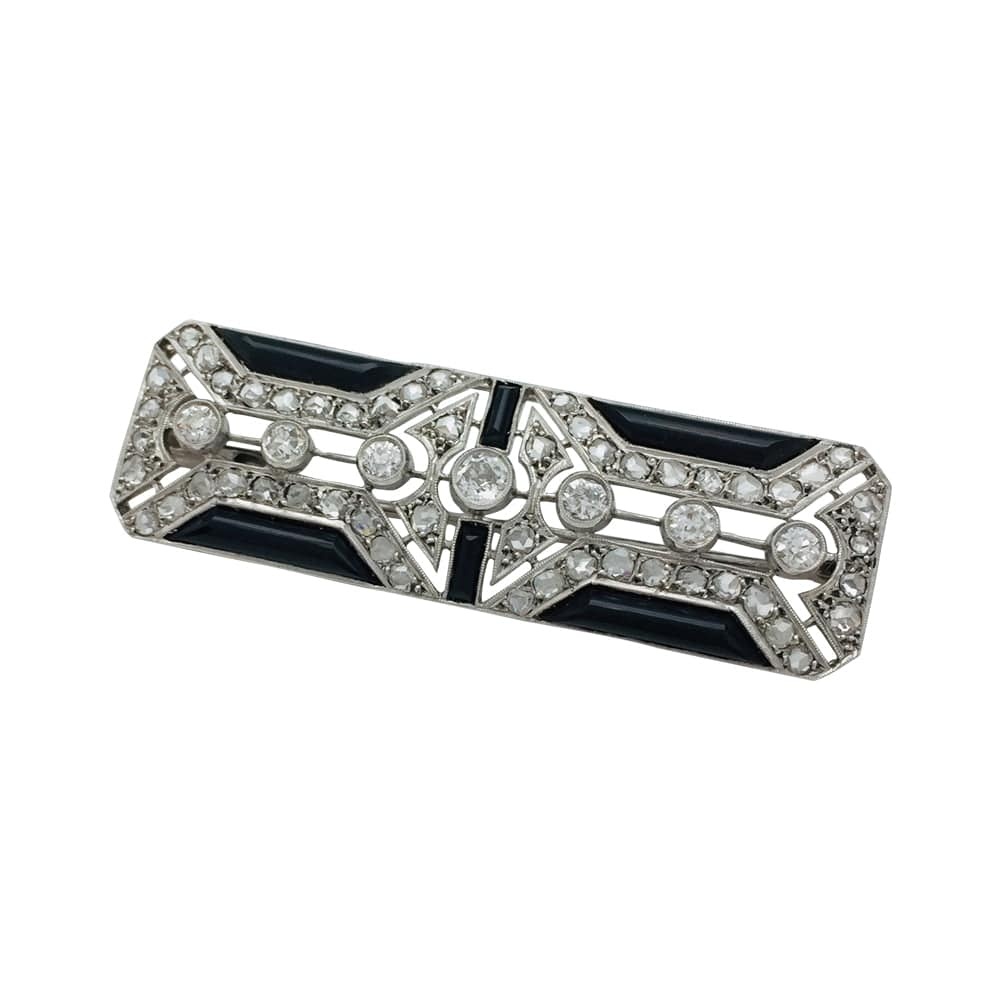 Pin Art Deco in platinum, diamonds and onyx.