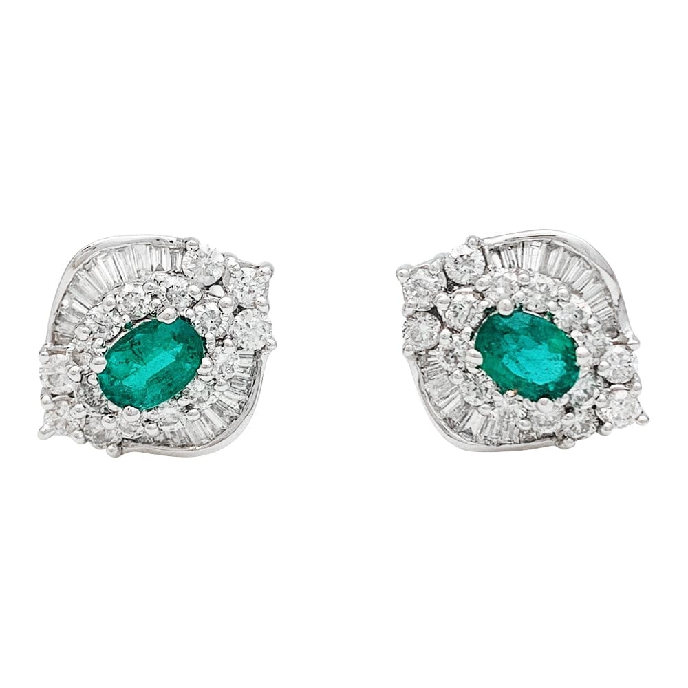 White gold diamond and emerald earrings.