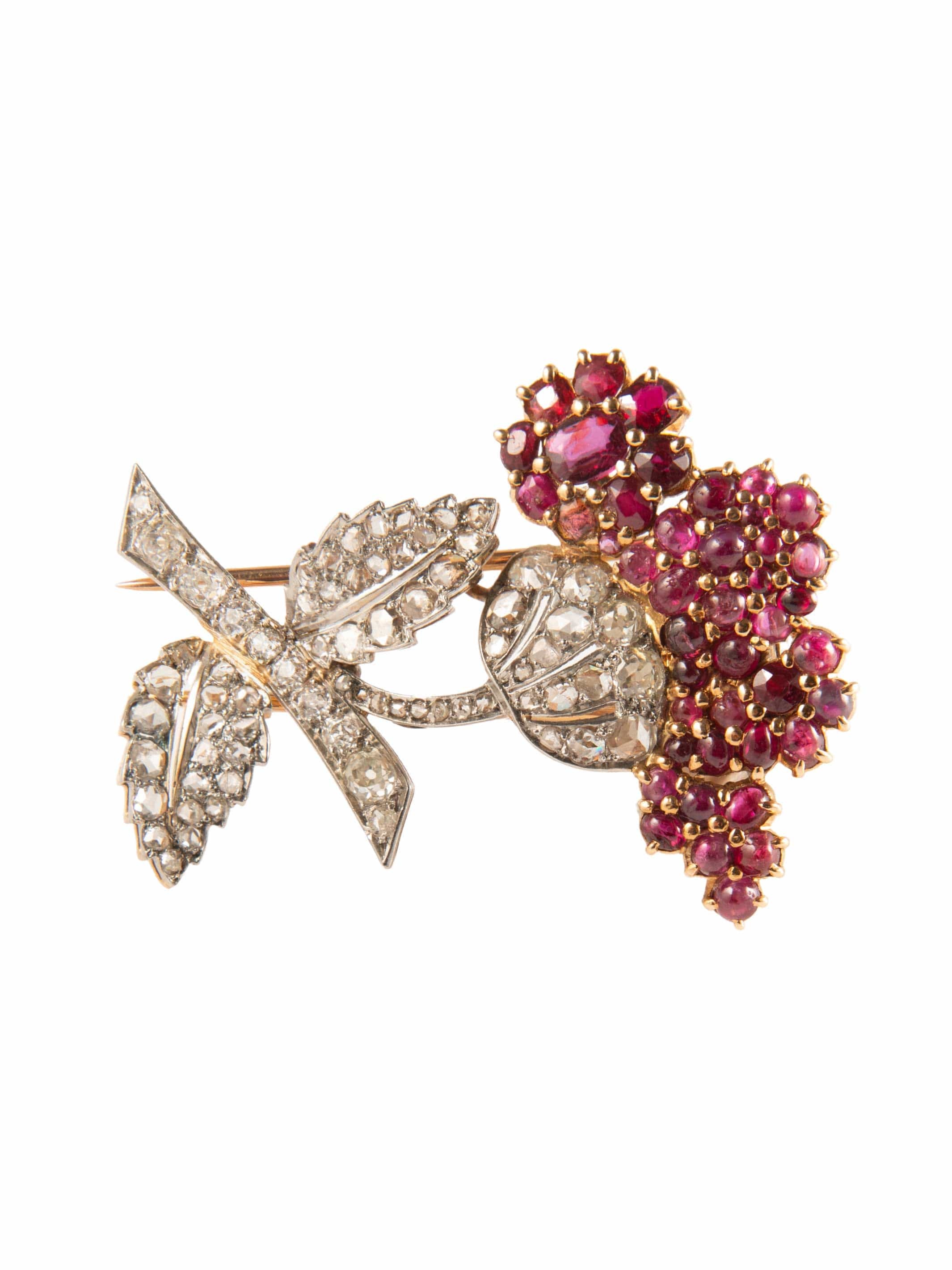 Flower brooch in two golds, ruby and diamond paving