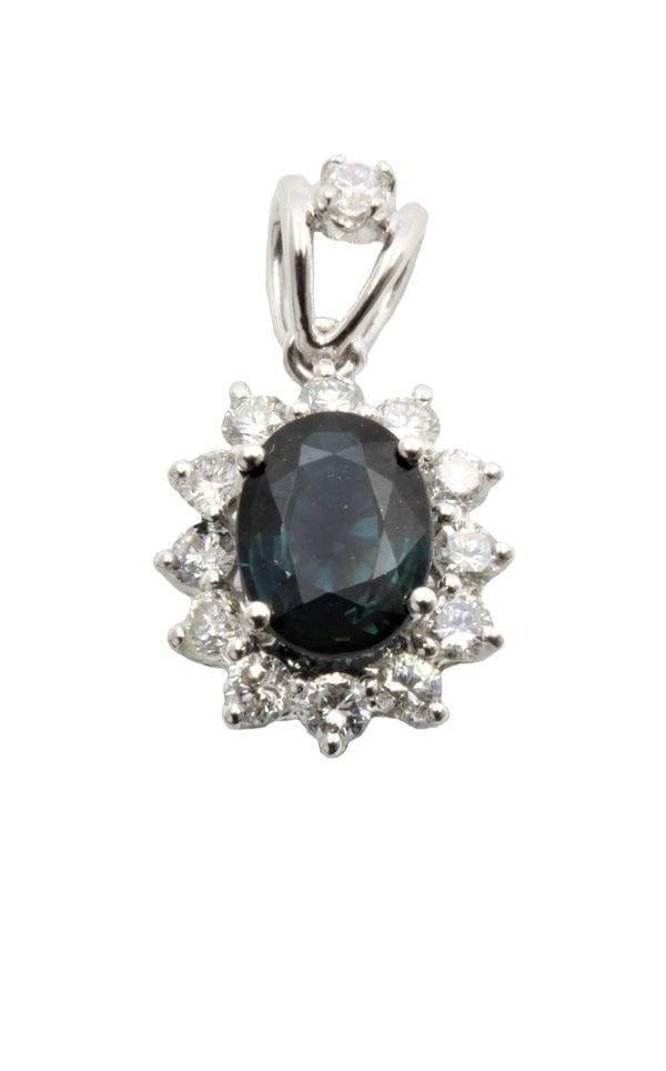 Sapphire pendant surrounded by diamonds